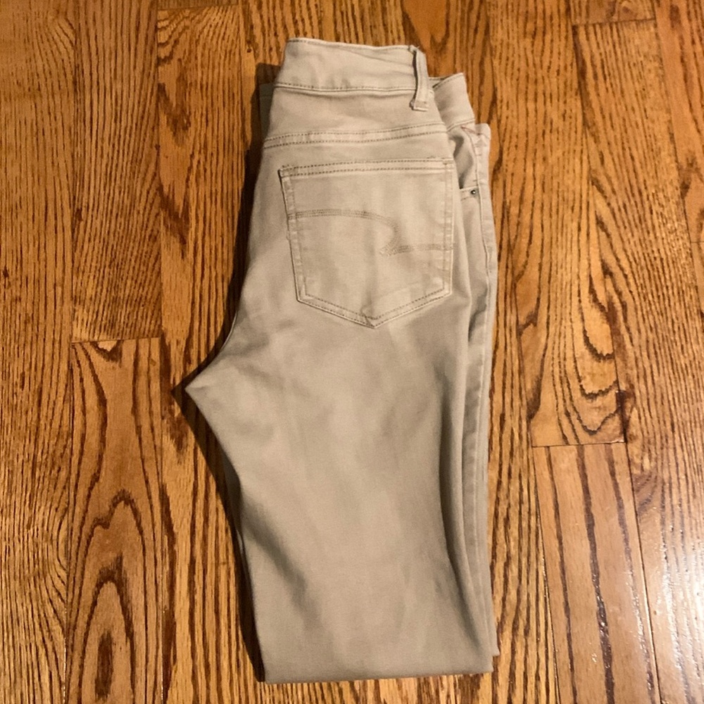 Like new women’s beige/Tan Boot Cut Jeans Size 4